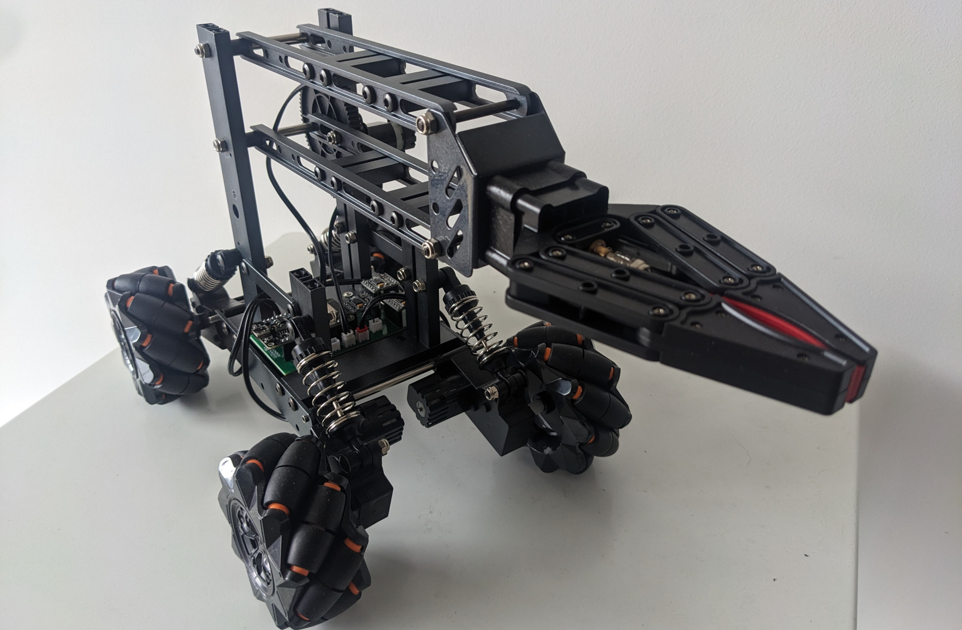 Advanced Robotics with Mecanum Wheels and Robotic Arm.
